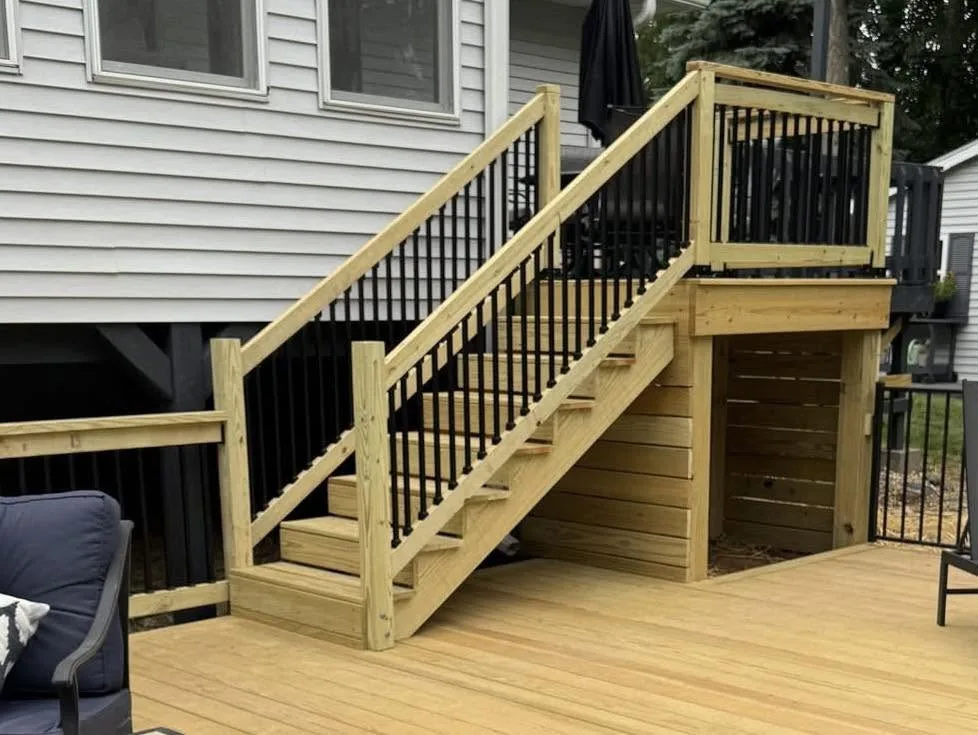 New custom pressure-treated wood deck with stairs and under-deck storage in Pekin, Illinois