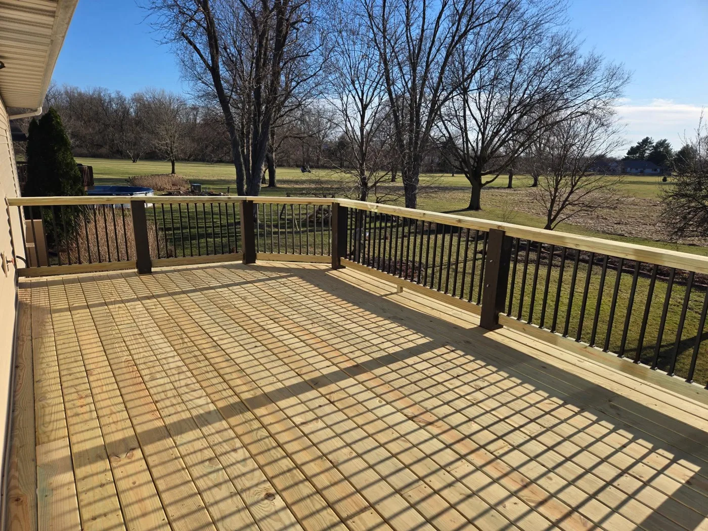 Large new wood deck overlooking open countryside in Central Illinois